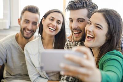 group of four friends smiling | teeth whitening los gatos