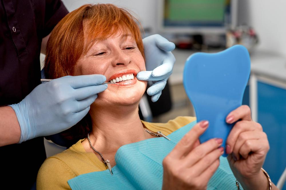 woman smiling after getting dental veneers