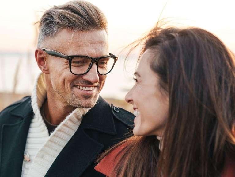 man in glasses with woman smiling | dental crowns & bridges los gatos ca
