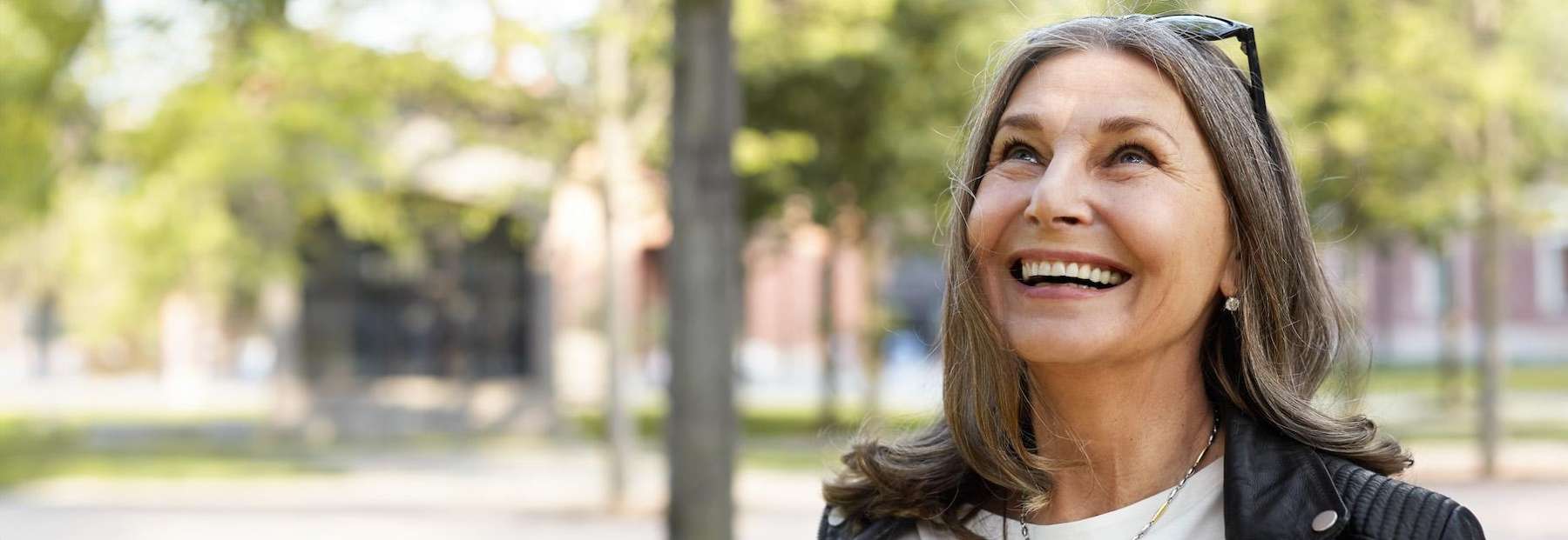 older woman smiling outside | dentist los gatos ca