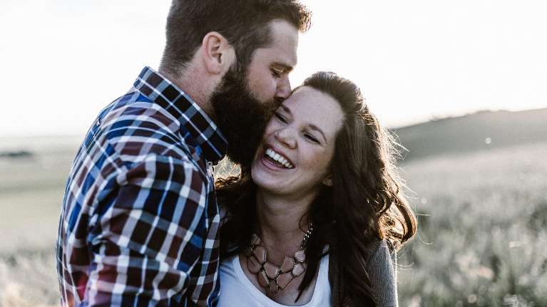 young couple hugging | porcelain veneers los gatos ca