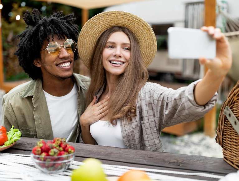 young couple talking selfie | dental crowns loa gatos ca