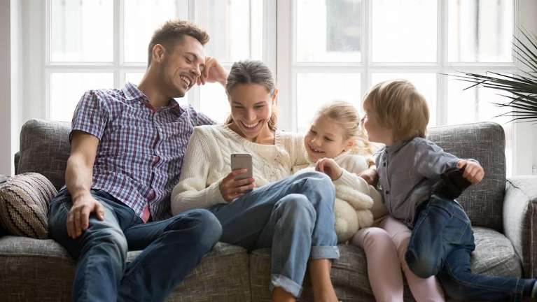 family sitting on couch | dentist in los gatos ca