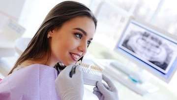 woman picking tooth shade | teeth whitening los gatos ca