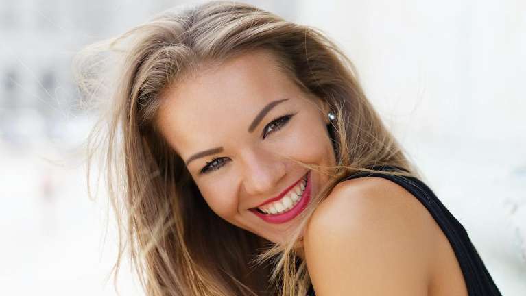 woman with red lip stick smiling | cosmetic dentist los gatos ca
