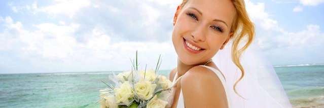 bride smiling at beach | cosmetic dentistry los gatos