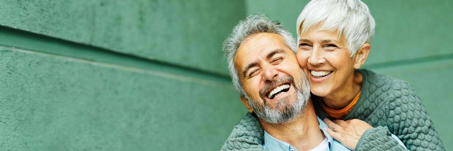 older couple hugging | dental implants los gatos ca