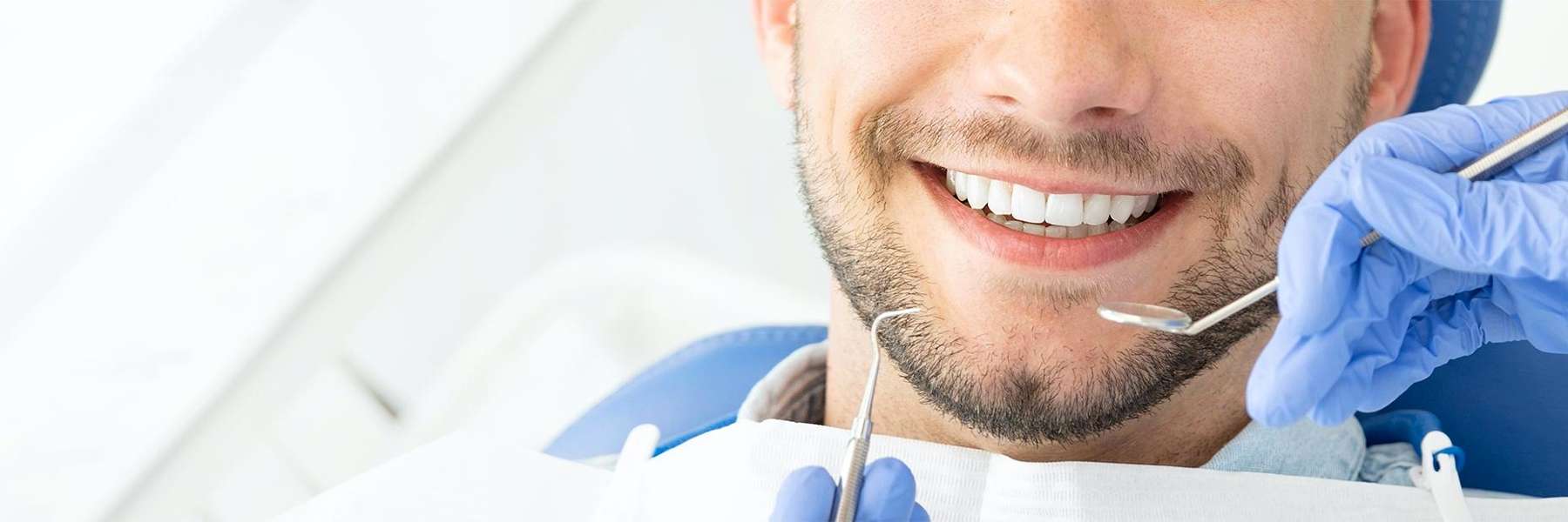 man receiving dental care | dental cleanings in los gatos